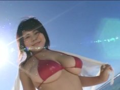 Busty Japanese harlow Puchi Dib shows off her charms at the beach